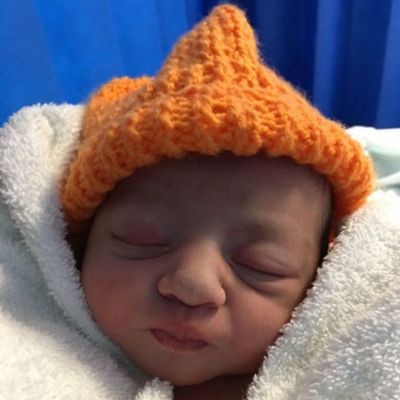 Baby with orange hat