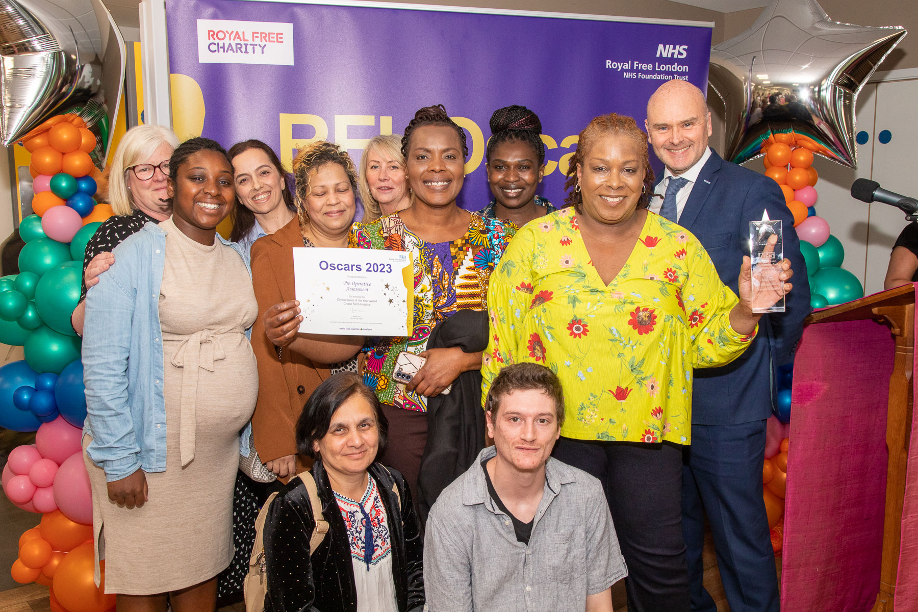 pre-operative assessment team posing for the camera with their awards alongside Alan McGlennan